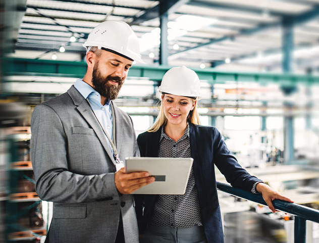 Engineers reviewing plans in an industrial facility